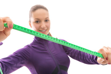 Smiling woman measuring