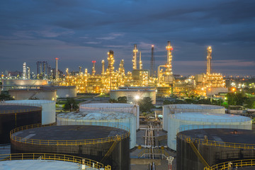 Oil refinery and  storage tanks at twilight