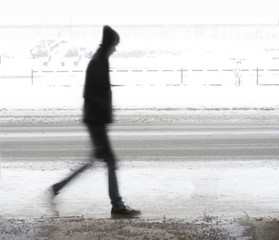 Young man walking in winter