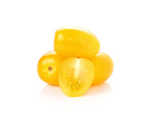 Yellow tomatoes isolated on white background