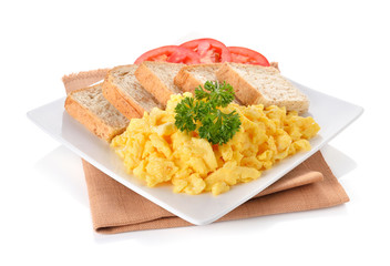 scrambled eggs with parsley,tomato and bread on white background