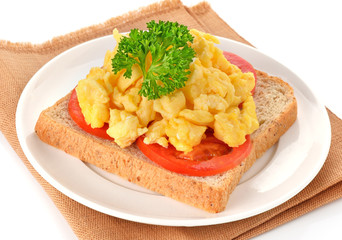 scrambled eggs with parsley,tomato and bread