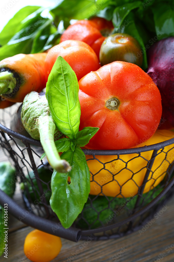 Poster fresh vegetables in metal basket