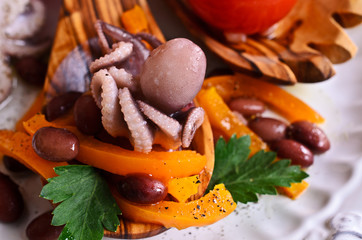 Salad of cooked beans, vegetables and octopus