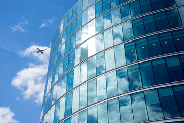 Fototapeta na wymiar airplane with business office background, London