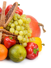 vegetables and fruits in a basket isolated on white background