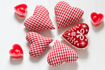 Red valentine's hearts with candes on white backgraunds