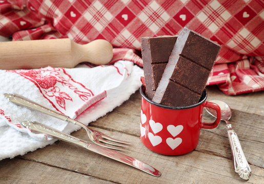 Modica chocolate bar inside hearts decorated mug with kitchen ut