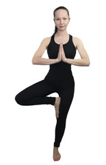 Young girl practicing yoga, tree pose