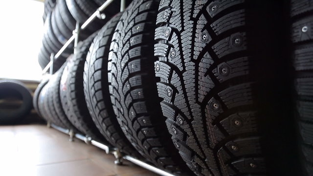 Large stand with wheel tires in an auto parts store