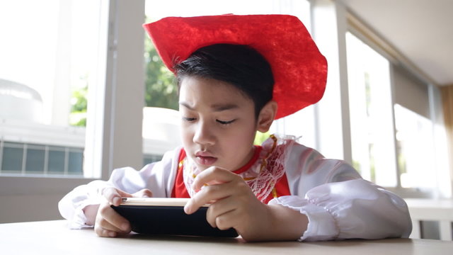 Asian child using a digital tablet together .