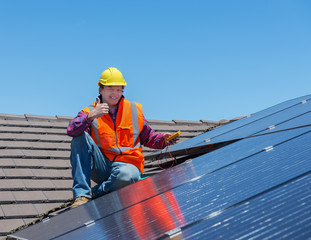 worker and solar panels