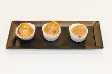 Home made muffins isolated on a table