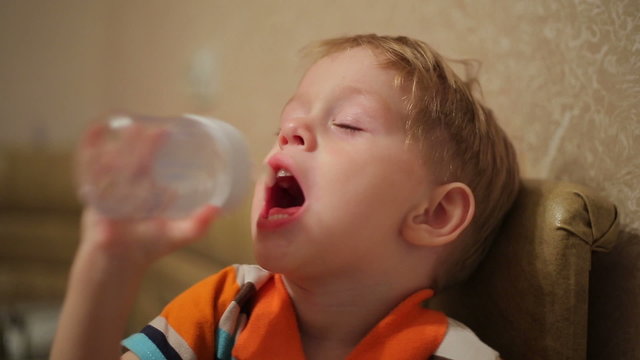 Kid cartoon looks and sucks a bottle of water
