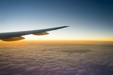 Fototapeta na wymiar Airplane Wing in Flight from window..