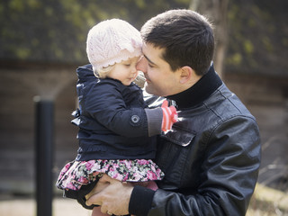 Father and daughter outdoors in Autumn