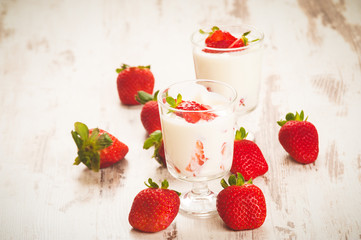 Fluffy and full of vitamins healthy strawberries on white wooden