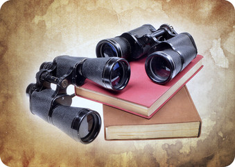 Vintage old  binoculars on ancient book . Nostalgic vintage