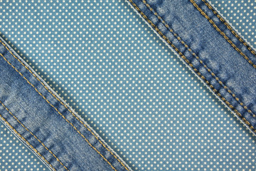 Jeans with stitch on blue dot cloth background
