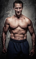 Fototapeta na wymiar Middle-aged man with muscular body