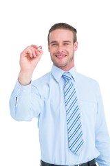 Smiling businessman in shirt writing with marker
