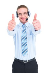 Positive businessman with handset and thumbs up