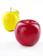 Green and red apple with leaves isolated on white