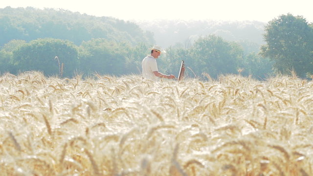 painter in the middle of a cornfield paints a beautiful landscape, canvas, easel