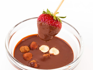 beautiful delicious strawberry with chocolate and nuts on stick