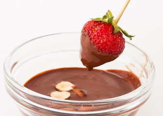 beautiful delicious strawberry with chocolate and nuts on stick