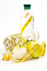 Apple core, bottled water for healthy life over a white backgrou