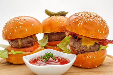 Fastfood - Three hamburgers with ketchup sause