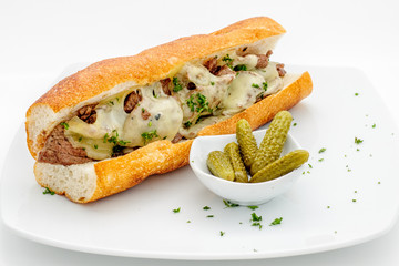 Fastfood - French baguette with meatballs and cheese