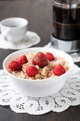 Cereal with strawberries and raspberries for breakfast