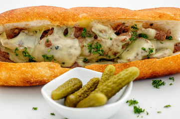 Fastfood - French baguette with meatballs and cheese