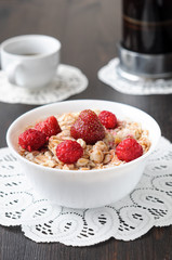 Cereal with strawberries and raspberries for breakfast
