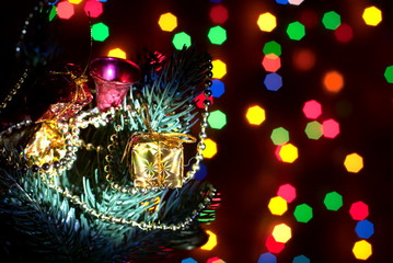 a Christmas tree with toys with garlands of bokeh