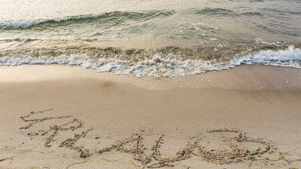 Schriftzug am Strand