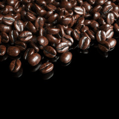 Roasted coffee beans on black background for advertising