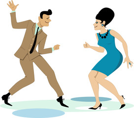 Couple dressed in early 1960s fashion dancing twist