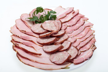 Plate of smoked meat isolated on white background