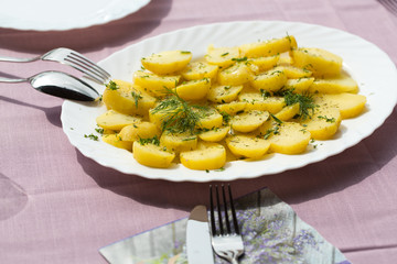 Delicious boiled potatoes with dill and olive
