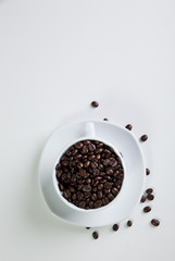Coffee cup and beans on a white background.
