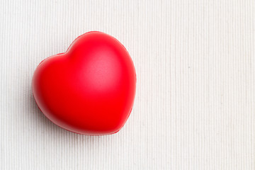 Red heart on cloth background