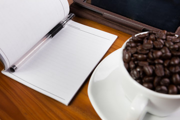 Digital tablet pc on business desk with blank white screen