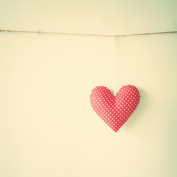 Vintage cotton heart hanging from a line