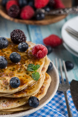 Pancakes with blueberry, raspberry honey and mint