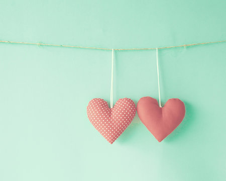 Vintage cotton hearts hanging from a line