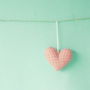 Vintage cotton heart hanging from a line