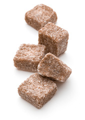 Brown lump cane sugar cube isolated on white background cutout